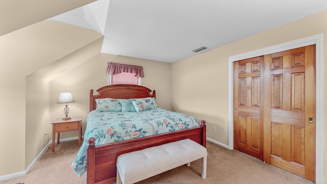 carpeted bedroom with a closet