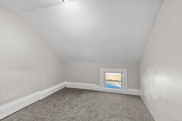 bonus room featuring carpet flooring, vaulted ceiling, and baseboard heating