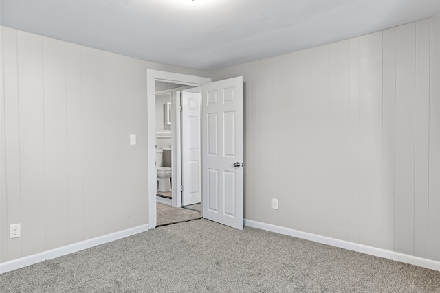 unfurnished room with carpet floors