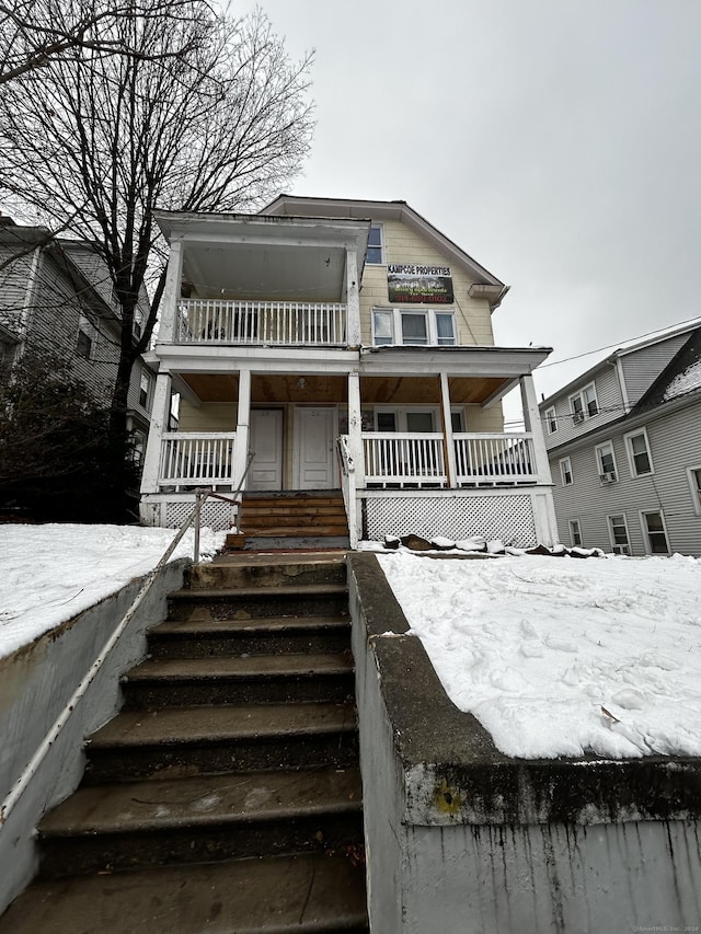 view of front of property featuring covered porch