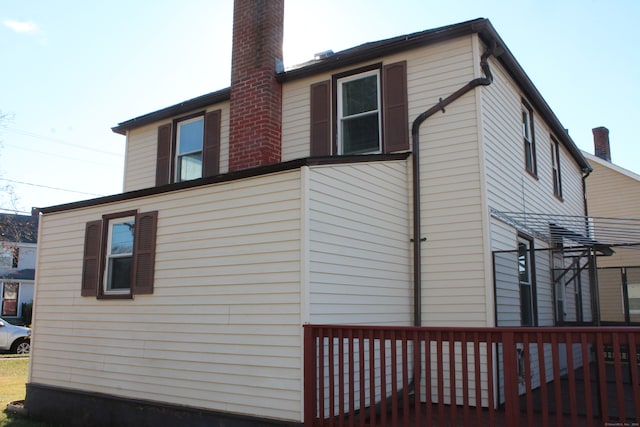 view of side of property with a deck