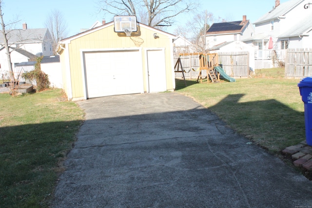 garage featuring a yard