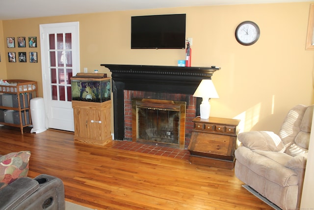 living room featuring a fireplace and hardwood / wood-style floors