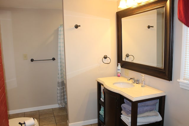 bathroom with tile patterned flooring and vanity