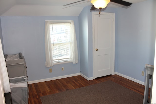 unfurnished bedroom with vaulted ceiling, ceiling fan, and dark hardwood / wood-style floors