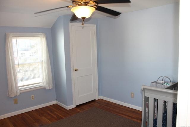 unfurnished bedroom featuring vaulted ceiling, ceiling fan, and dark hardwood / wood-style floors