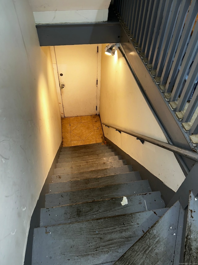 staircase featuring hardwood / wood-style floors