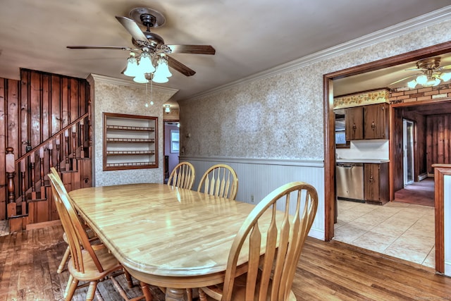 dining space featuring ceiling fan, light hardwood / wood-style floors, and ornamental molding