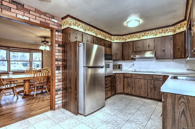 kitchen with ceiling fan, light hardwood / wood-style floors, dark brown cabinetry, and stainless steel appliances