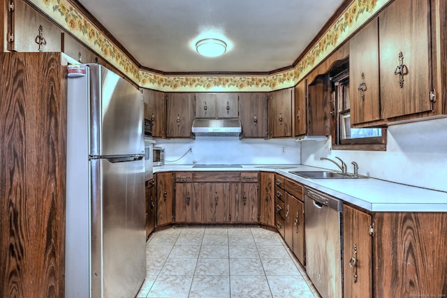 kitchen featuring dark brown cabinets, light tile patterned flooring, sink, and stainless steel appliances