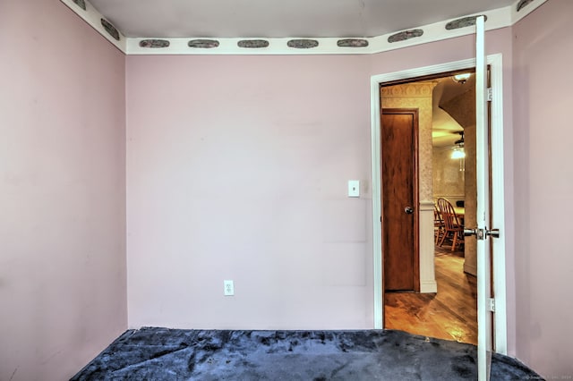 empty room featuring ceiling fan and wood-type flooring