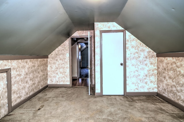 bonus room featuring carpet and lofted ceiling