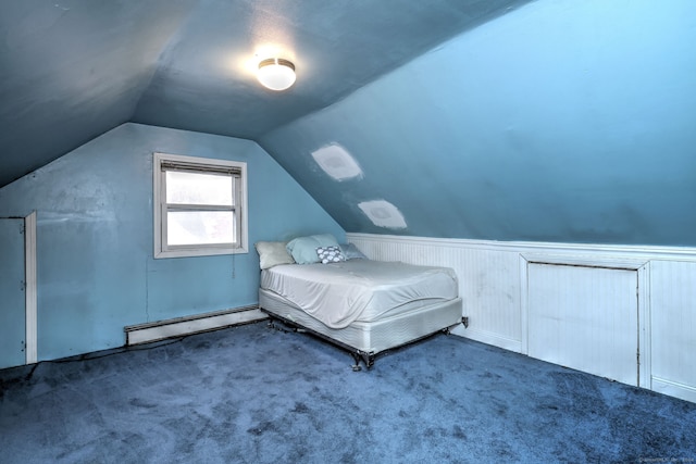 unfurnished bedroom with dark colored carpet, lofted ceiling, and a baseboard heating unit