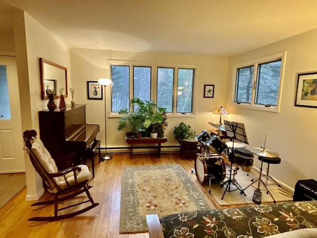 office space with baseboard heating and hardwood / wood-style floors