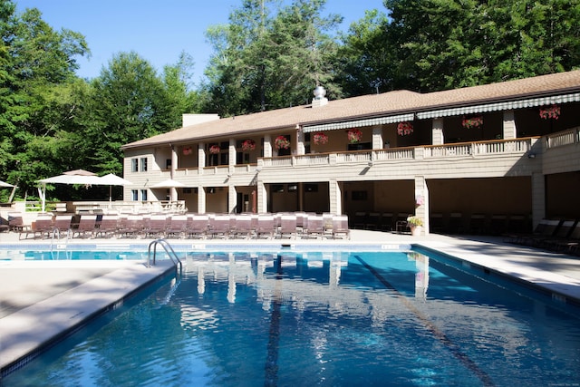 view of swimming pool with a patio