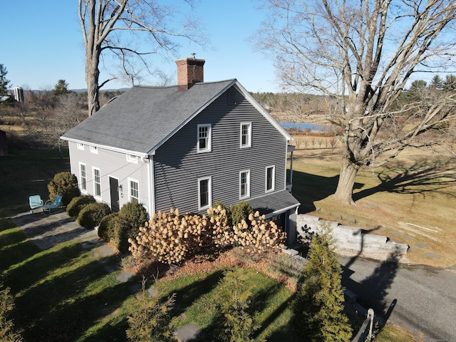 view of home's exterior with a yard