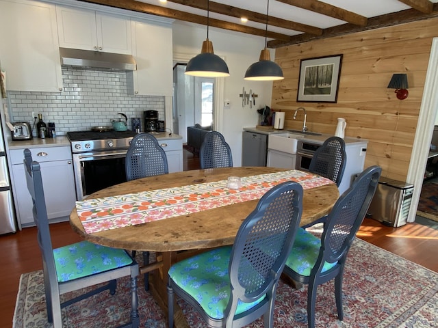140 Lime Rock Rd, Salisbury, CT 06039 - dining space with dark wood-style flooring, beamed ceiling, and wooden walls