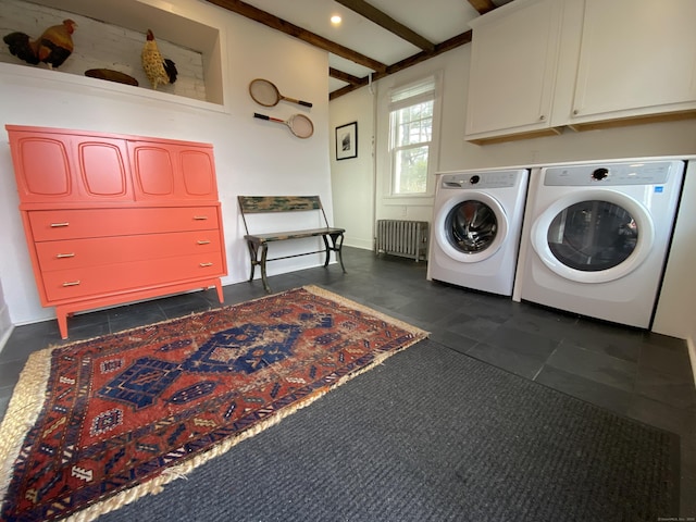 laundry area with independent washer and dryer, cabinets, and radiator heating unit