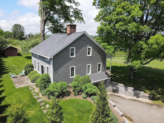 140 Lime Rock Rd, Salisbury, CT 06039 - view of property exterior featuring a chimney, a yard, and a shingled roof
