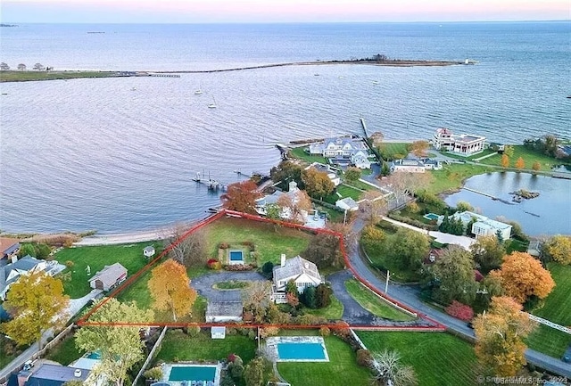 aerial view at dusk with a water view