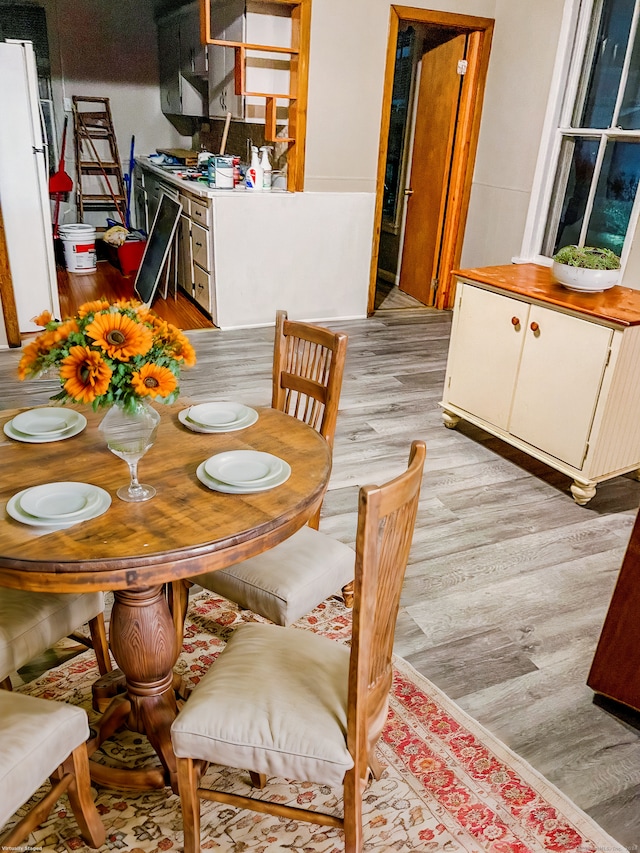 dining space featuring light wood-type flooring