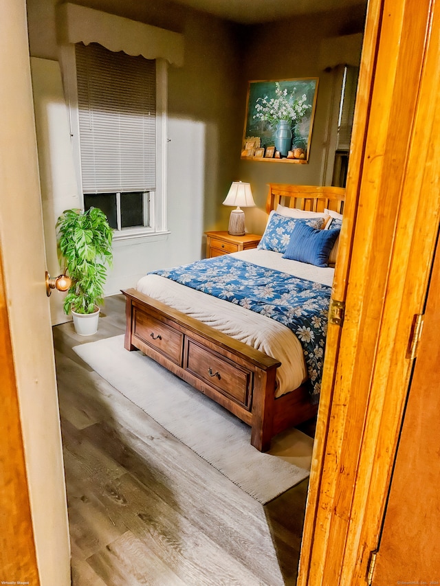 bedroom featuring hardwood / wood-style flooring