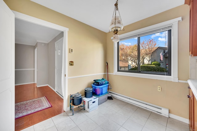 999 Heritage Vlg Unit B, Southbury, CT 06488 - unfurnished dining area with baseboard heating and light wood finished floors