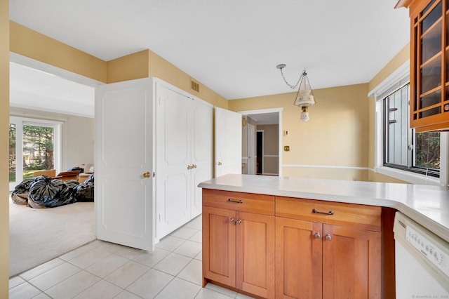999 Heritage Vlg Unit B, Southbury, CT 06488 - kitchen with white dishwasher, light tile patterned floors, light countertops, and glass insert cabinets
