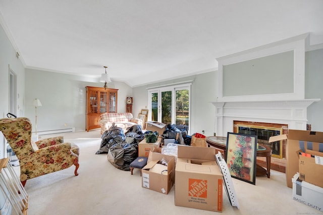 999 Heritage Vlg Unit B, Southbury, CT 06488 - living area featuring a baseboard heating unit, carpet floors, ornamental molding, a glass covered fireplace, and lofted ceiling