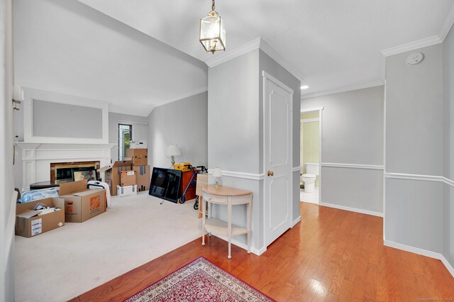 999 Heritage Vlg Unit B, Southbury, CT 06488 - interior space with wood-type flooring, a glass covered fireplace, and crown molding