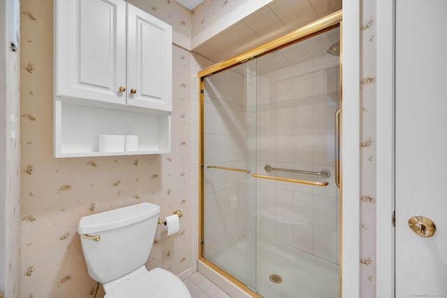 bathroom with toilet and walk in shower