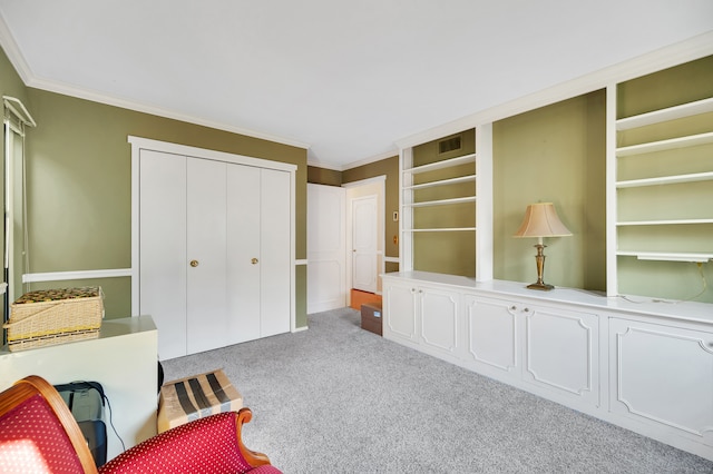 sitting room with light carpet and ornamental molding