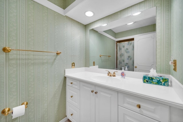 999 Heritage Vlg Unit B, Southbury, CT 06488 - bathroom featuring vanity and wallpapered walls