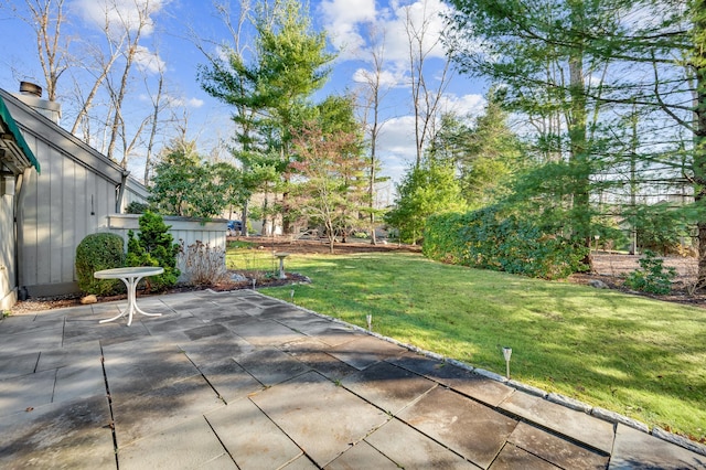 999 Heritage Vlg Unit B, Southbury, CT 06488 - view of green lawn with a patio