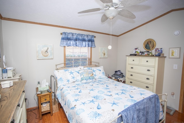 bedroom featuring crown molding, ceiling fan, vaulted ceiling, and light hardwood / wood-style flooring