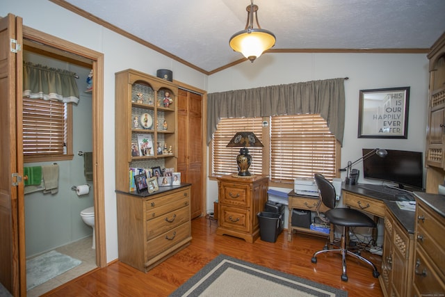 office area featuring vaulted ceiling, crown molding, a textured ceiling, and light hardwood / wood-style floors