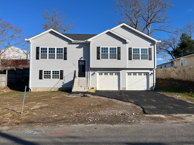 bi-level home featuring a garage