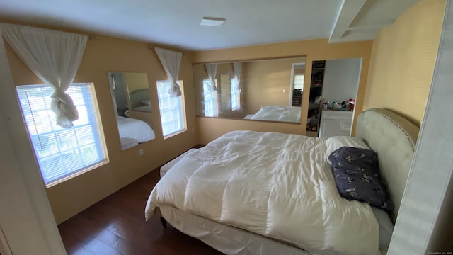 bedroom featuring dark hardwood / wood-style floors