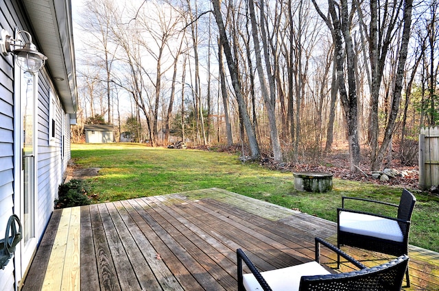 deck with a storage unit and a yard