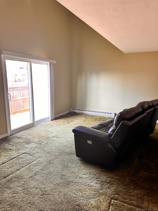 living room with carpet floors, high vaulted ceiling, and a baseboard heating unit