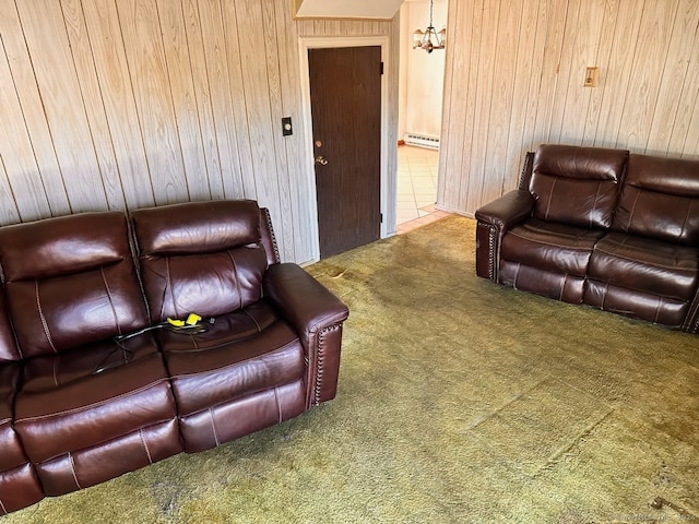 living room with wood walls, carpet floors, and a baseboard heating unit