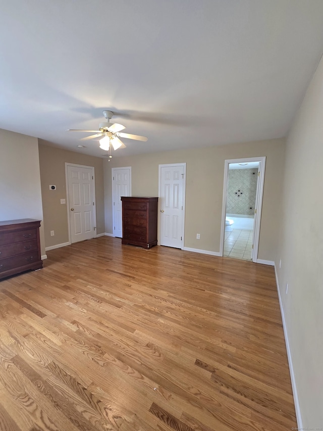 unfurnished room featuring ceiling fan and light wood-type flooring