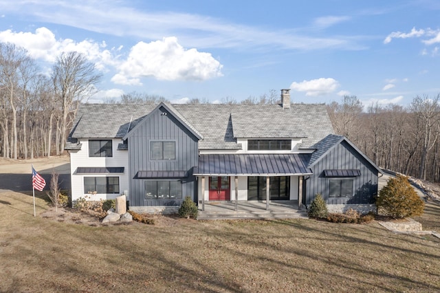 back of property featuring a patio and a lawn