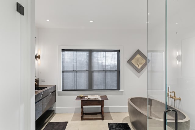 bathroom featuring vanity and independent shower and bath