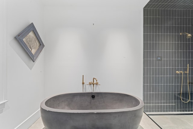 bathroom with tile patterned flooring and independent shower and bath