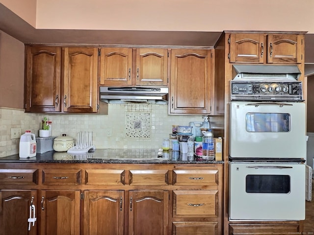 kitchen featuring stovetop, backsplash, and double wall oven