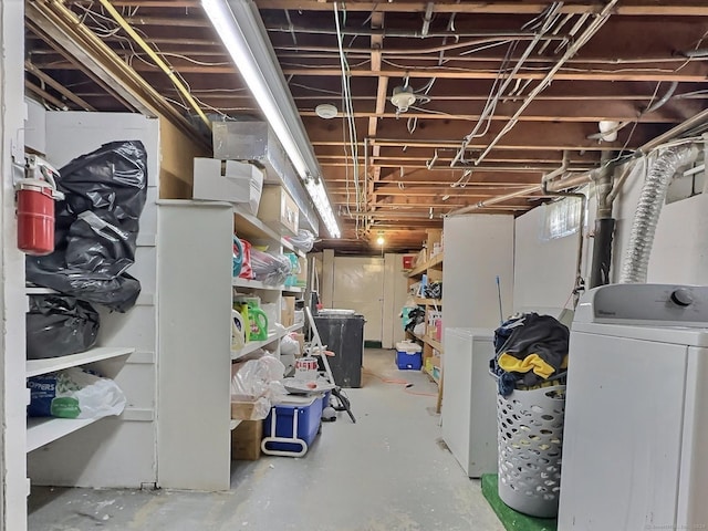 basement featuring refrigerator and washer / clothes dryer