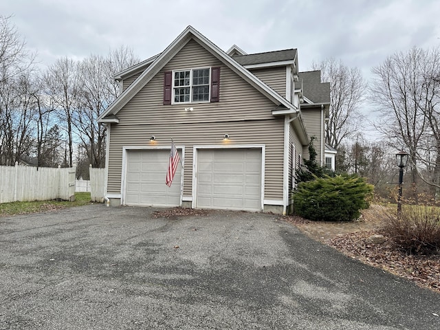 view of side of property with a garage