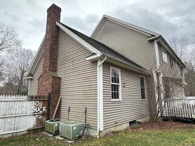 view of side of home with cooling unit