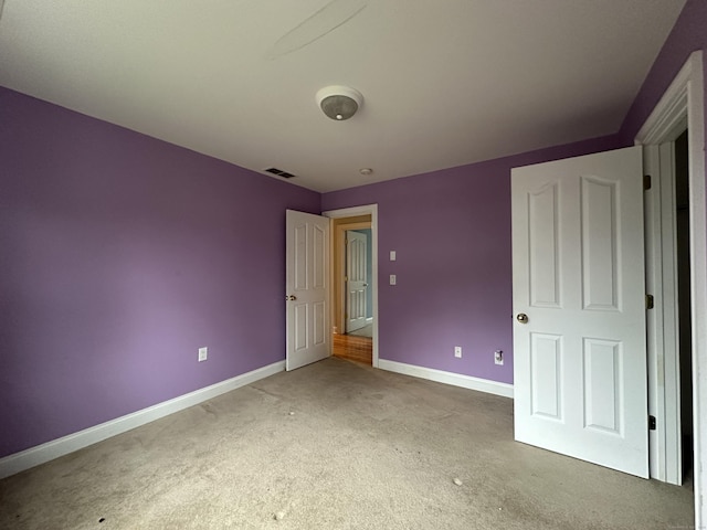 unfurnished bedroom with carpet flooring